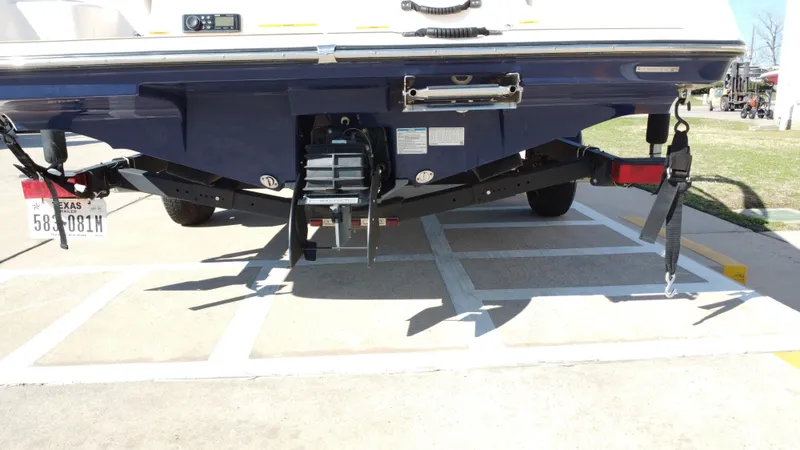 Slide: The Image of Rear view of a 2022 Yamaha TP1800C-XAP boat on a trailer. - 22