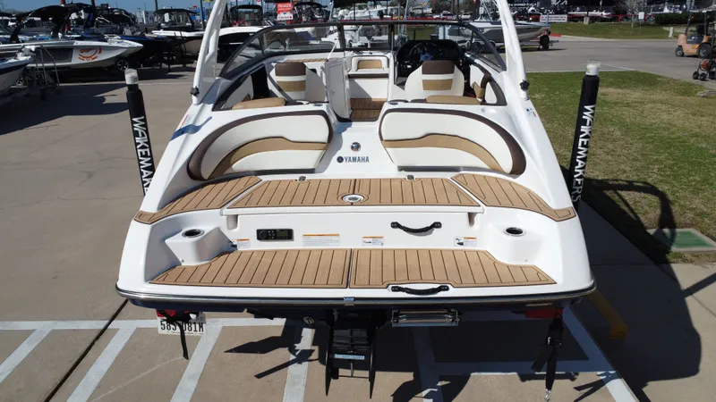 Slide: The Image of Rear view of a 2022 Yamaha TP1800C-XAP boat on a parking lot. - 24