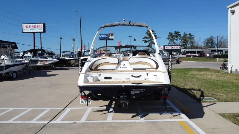 Slide: The Image of Rear view of a 2022 Yamaha TP1800C-XAP boat at Premier Boating Centers. - 5