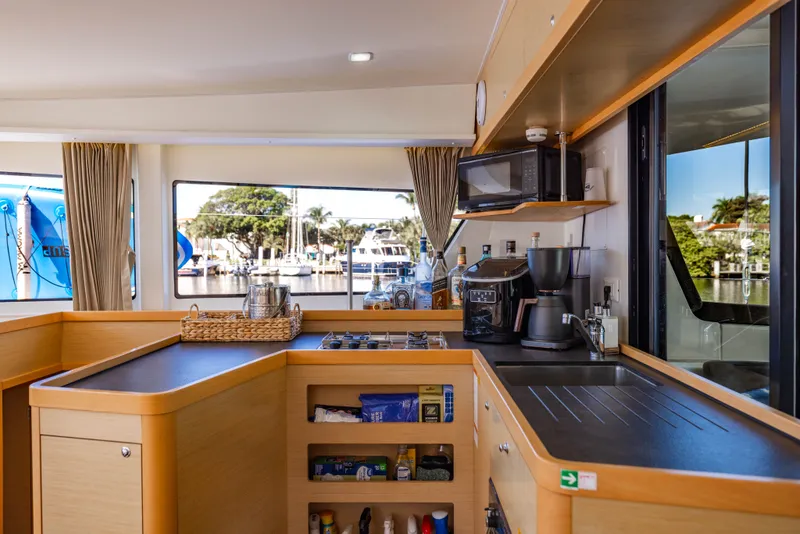 Slide: The Image of Interior of Lagoon 42 yacht kitchen, 2018 model, featuring modern appliances. - 12