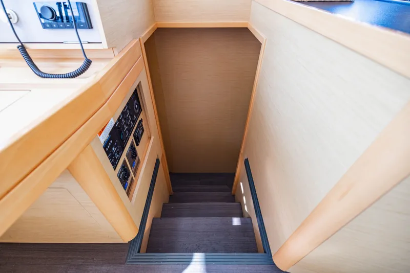 Slide: The Image of Interior of Lagoon 42 yacht, stairway descent, year 2018. - 15