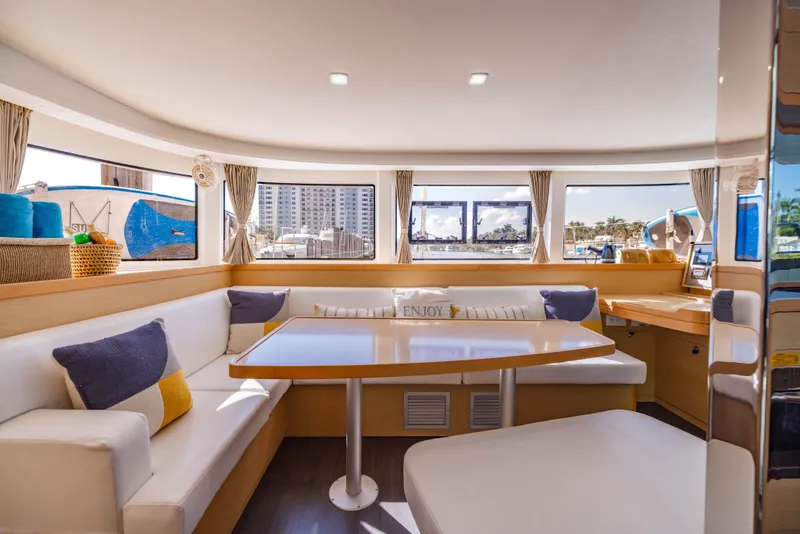 Slide: The Image of Interior of a 2018 Lagoon 42 yacht with cozy seating area. - 34