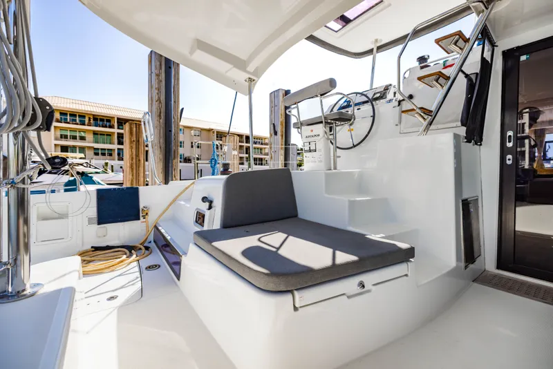 Slide: The Image of Lagoon 42 catamaran cockpit, 2018 model, featuring helm and seating area. - 44