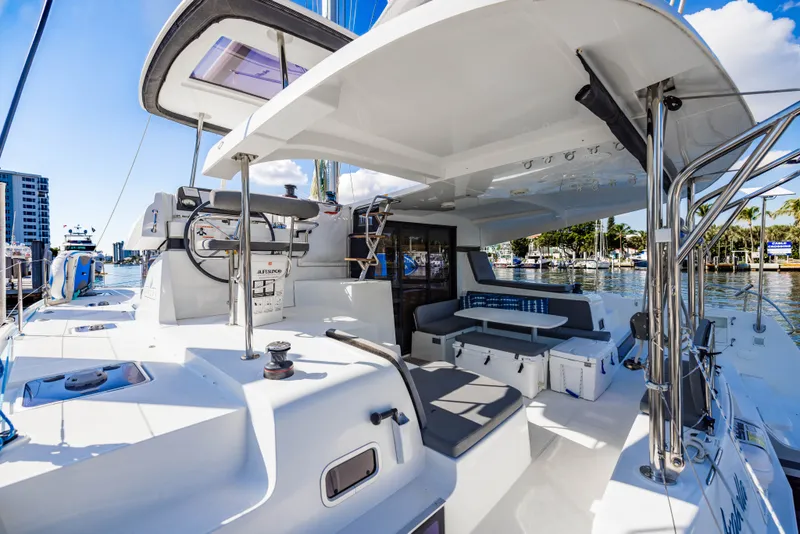 Slide: The Image of 2018 Lagoon 42 catamaran with modern deck design in harbor. - 48