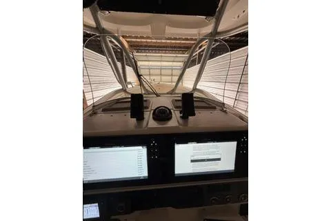 Slide: The Image of 2007 Hydra-Sports Vector 3300 CC boat dashboard with navigation screens and controls. - 18