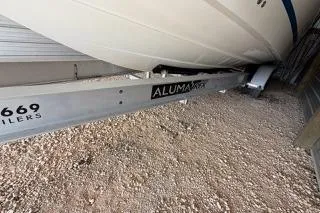 Slide: The Image of 2007 Hydra-Sports Vector 3300 CC on Alumax trailer, parked on gravel. - 2