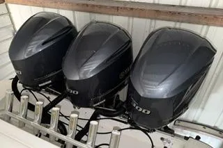 Slide: The Image of Triple outboard engines on a 2007 Hydra-Sports Vector 3300 CC boat. - 3