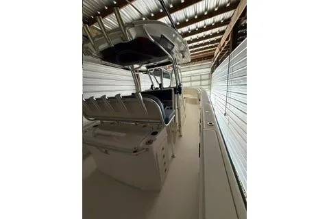 Slide: The Image of 2007 Hydra-Sports Vector 3300 CC boat in storage, featuring a sleek design and spacious deck. - 8