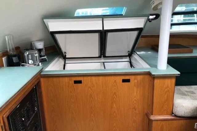 Slide: The Image of Interior of 2005 Manta 42 MK II yacht with open storage compartment. - 13