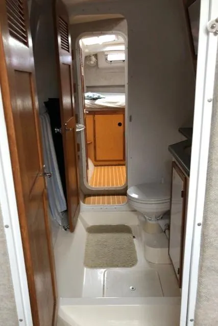 Slide: The Image of 2005 Manta 42 MK II yacht interior with bathroom and wooden cabinetry. - 15