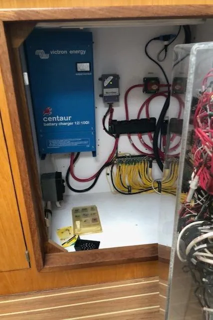 Slide: The Image of Electrical panel with Victron Energy Centaur battery charger in a 2005 Manta 42 MK II. - 17