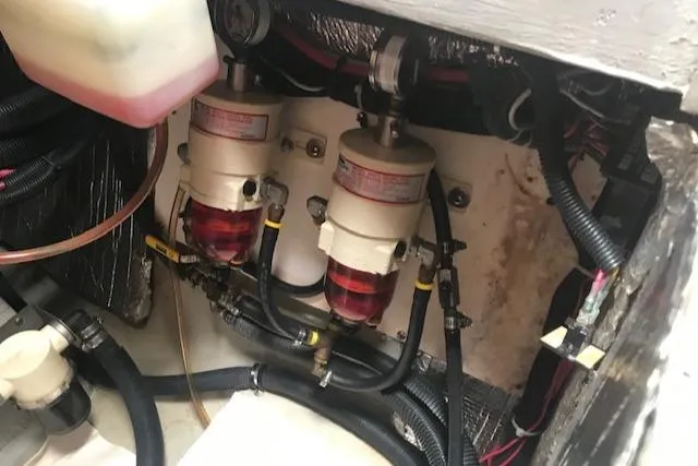 Slide: The Image of Engine compartment of a 2005 Manta 42 MK II with dual fuel filters and hoses. - 20