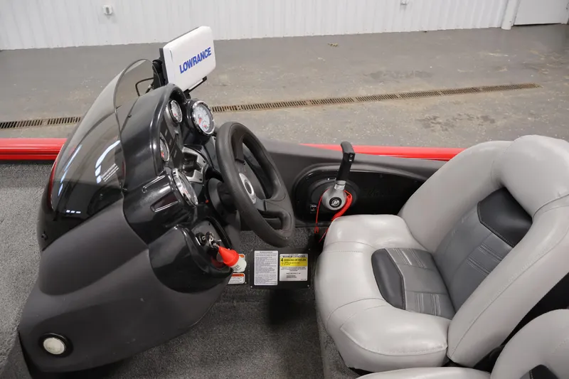 Slide: The Image of 2018 Tracker Pro Team 175 TXW boat cockpit with steering wheel and Lowrance electronics. - 16