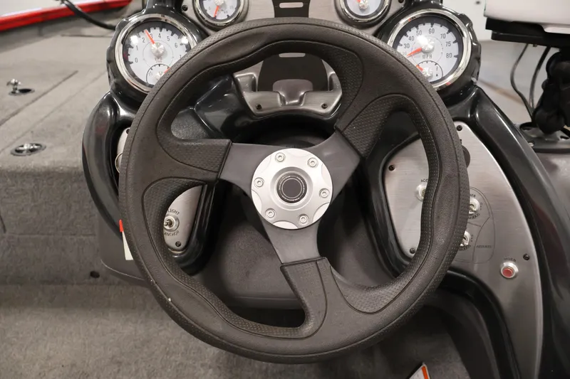 Slide: The Image of Steering wheel and dashboard of 2018 Tracker Pro Team 175 TXW boat. - 18