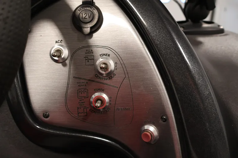 Slide: The Image of Control panel of 2018 Tracker Pro Team 175 TXW boat with switches and 12V outlet. - 23