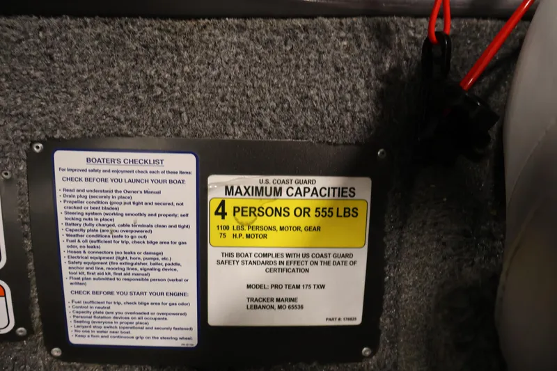 Slide: The Image of 2018 Tracker Pro Team 175 TXW capacity plate, showing maximum capacity of 4 persons or 555 lbs. - 24