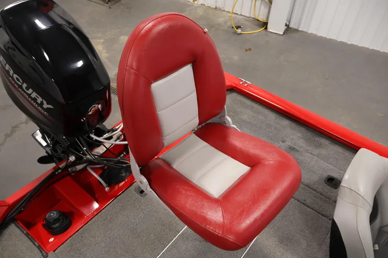 Slide: The Image of 2018 Tracker Pro Team 175 TXW boat seat with Mercury engine, red and gray design. - 30