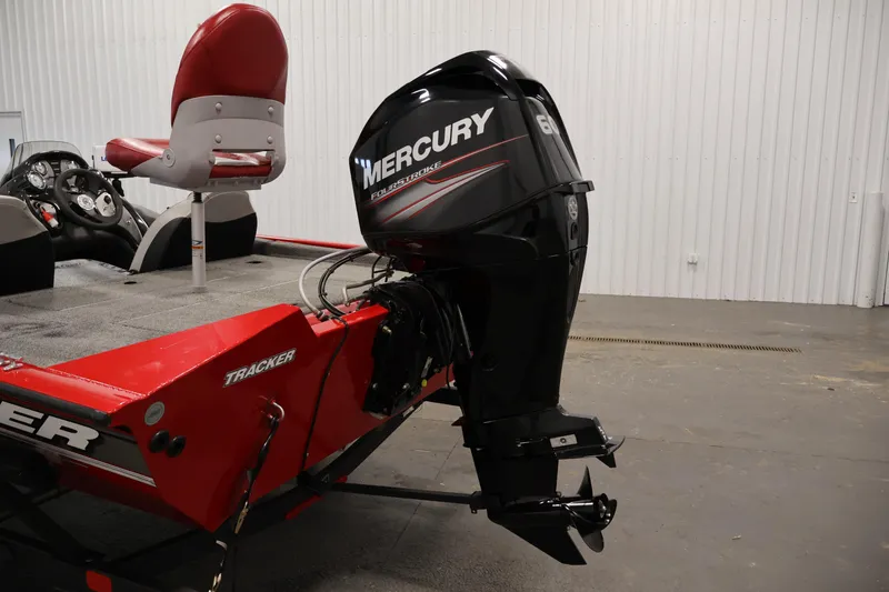 Slide: The Image of 2018 Tracker Pro Team 175 TXW boat with Mercury outboard motor in a garage. - 33