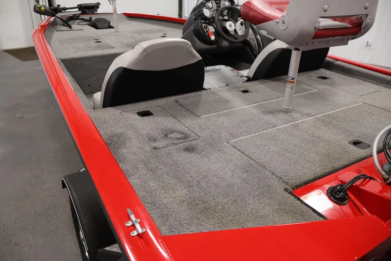Slide: The Image of 2018 Tracker Pro Team 175 TXW boat interior with red accents and seating. - 38