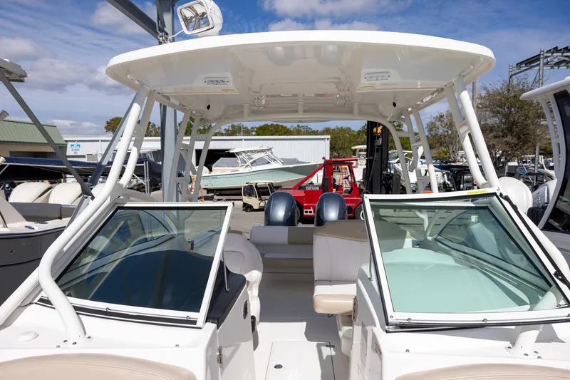 Slide: The Image of 2018 Robalo R247 Dual Console boat with spacious seating and modern design. - 16