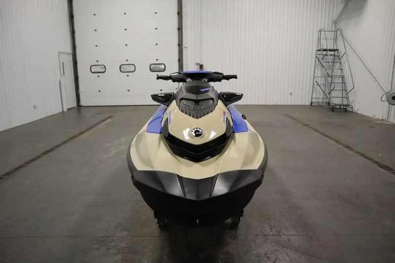 Slide: The Image of 2025 Sea-Doo Wake 170 jet ski in a spacious indoor garage setting. - 2