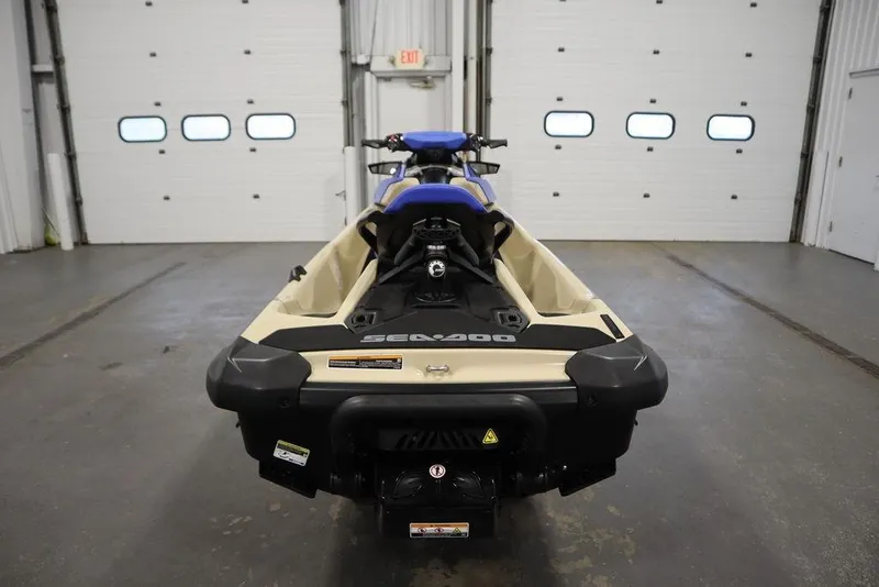 Slide: The Image of 2025 Sea-Doo Wake 170 jet ski in a garage, rear view. - 4