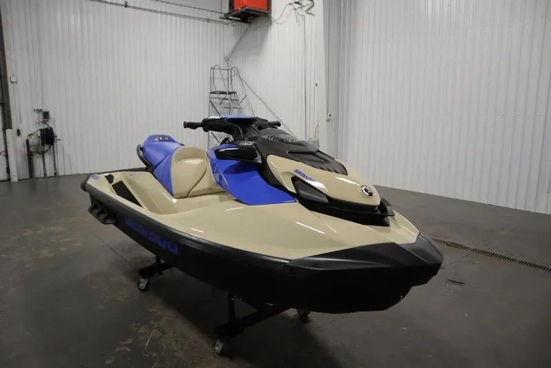 Slide: The Image of 2025 Sea-Doo Wake 170 jet ski in a garage, featuring blue and beige design. - 6