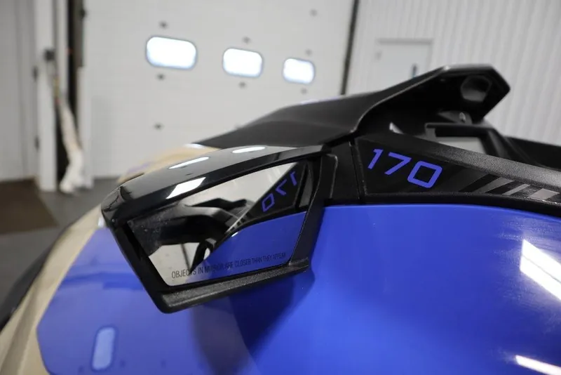 Slide: The Image of 2025 Sea-Doo Wake 170, close-up of side mirror and blue body detailing. - 7