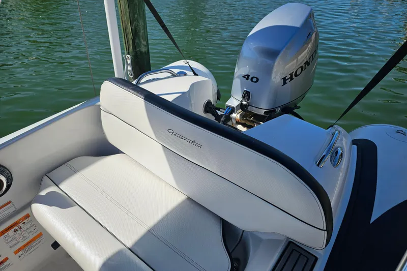 Slide: The Image of 2020 Walker Bay Generation 360 boat with Honda 40 engine on calm water. - 11