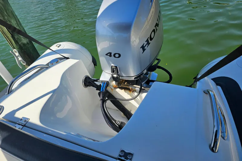 Slide: The Image of 2020 Walker Bay Generation 360 boat with Honda 40 outboard motor on water. - 14