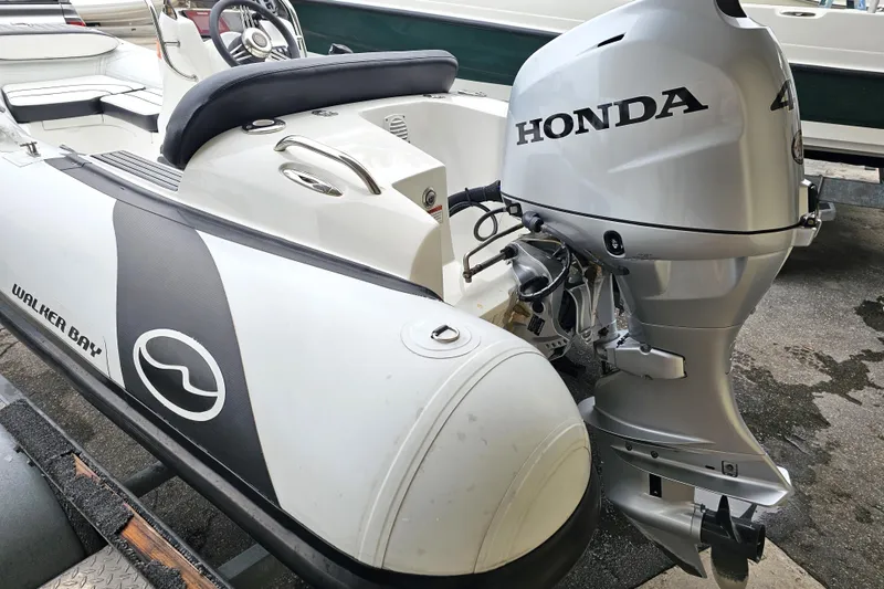 Slide: The Image of Walker Bay Generation 360 boat with Honda outboard motor, 2020 model. - 24