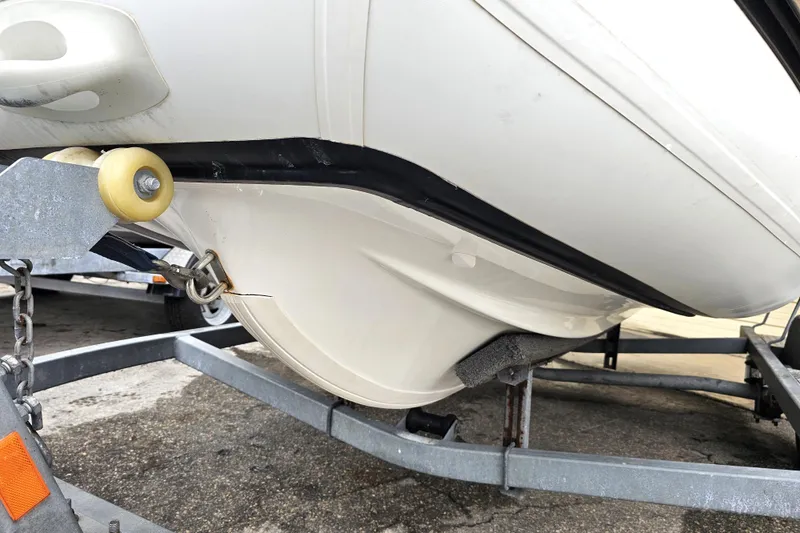 Slide: The Image of 2020 Walker Bay Generation 360 boat on trailer, showing hull detail and securing mechanism. - 26