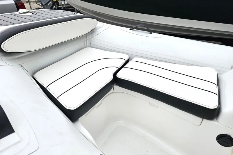 Slide: The Image of 2020 Walker Bay Generation 360 boat interior with white cushioned seating. - 28