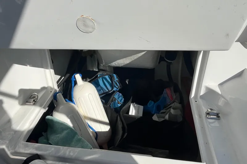 Slide: The Image of Storage compartment of 2020 Walker Bay Generation 360 boat with various boating accessories. - 7