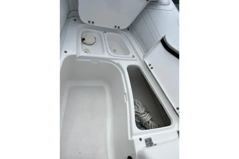 Slide: The Image of 2020 Walker Bay Generation 360 boat storage compartments with rope. - 8