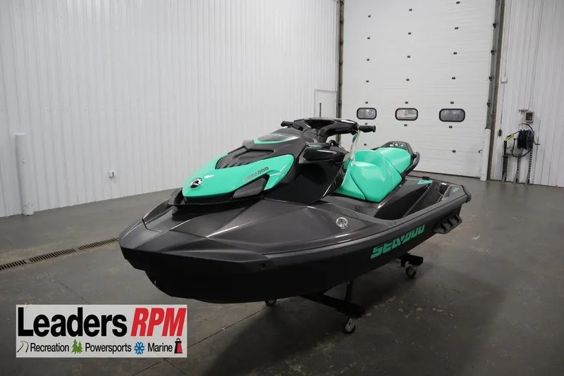 The Image of 2026 Sea-Doo GTI SE 170 jet ski in showroom, featuring sleek design and vibrant colors. - 0