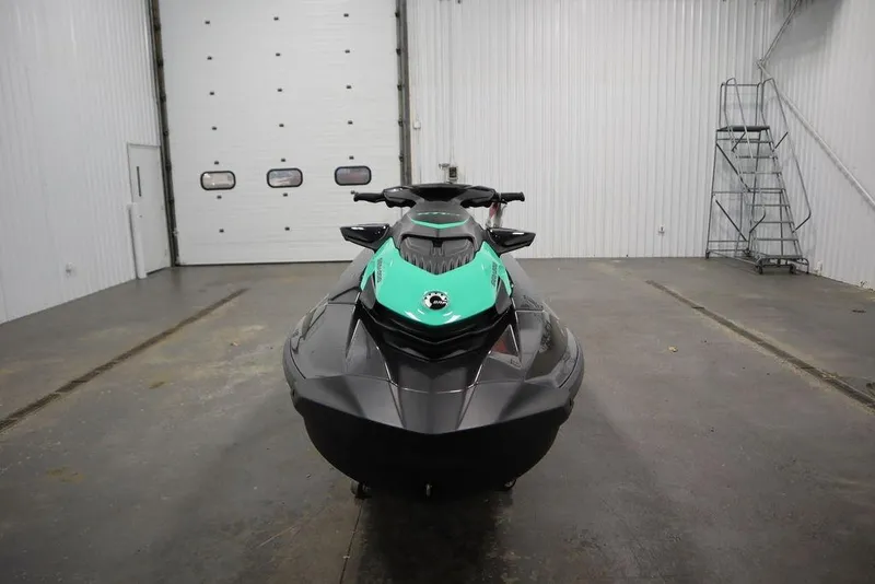 Slide: The Image of 2026 Sea-Doo GTI SE 170 jet ski in a garage, front view. - 1
