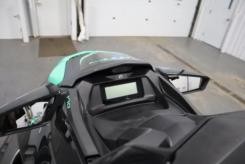 Slide: The Image of 2026 Sea-Doo GTI SE 170 dashboard with digital display in a garage setting. - 10