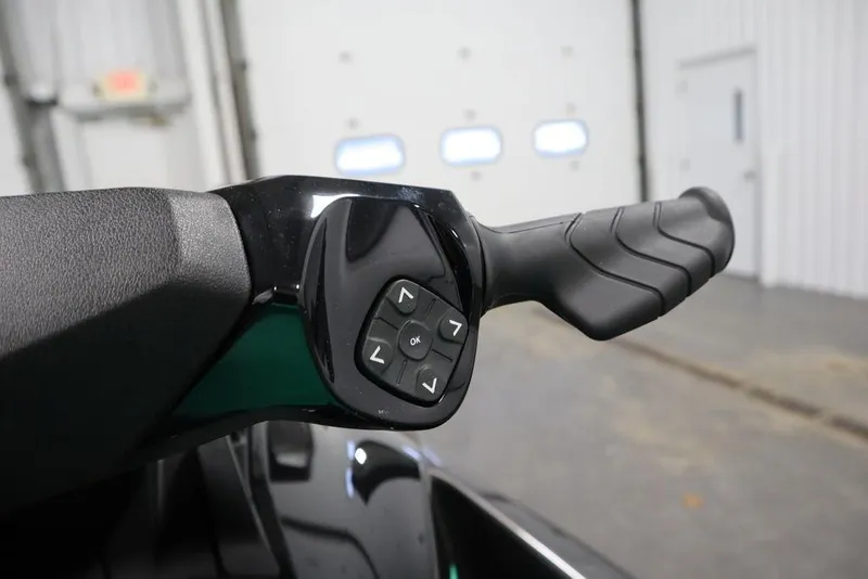 Slide: The Image of Handlebar controls of 2026 Sea-Doo GTI SE 170 in a garage setting. - 12
