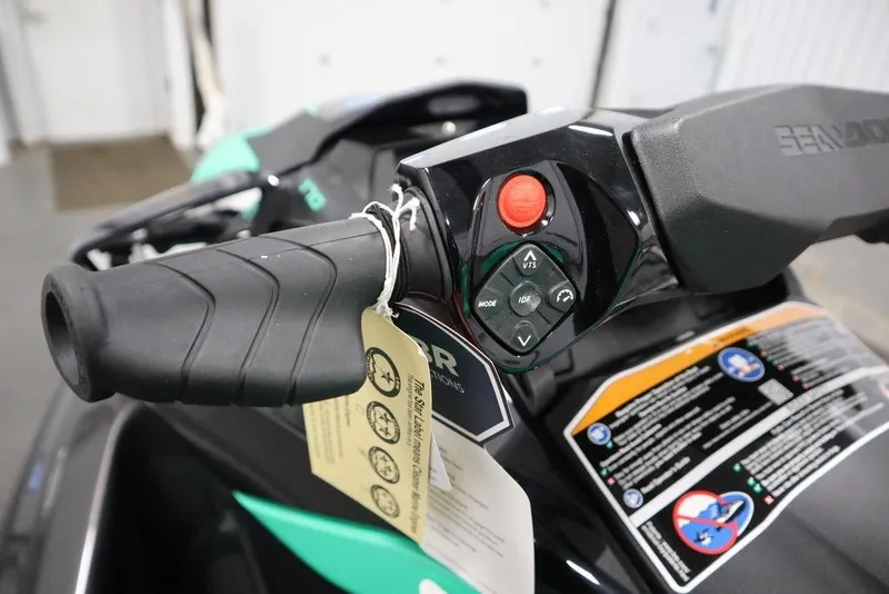 Slide: The Image of 2026 Sea-Doo GTI SE 170 handlebar controls with safety instructions tag. - 13