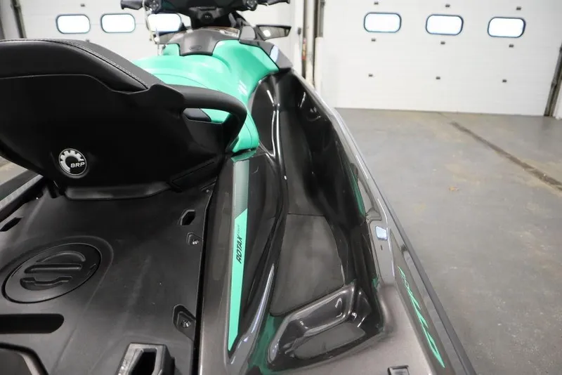 Slide: The Image of 2026 Sea-Doo GTI SE 170 jet ski in a garage, showcasing sleek design and seating. - 14