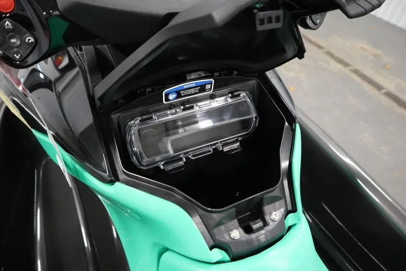Slide: The Image of 2026 Sea-Doo GTI SE 170 storage compartment with open lid, showcasing interior details. - 17