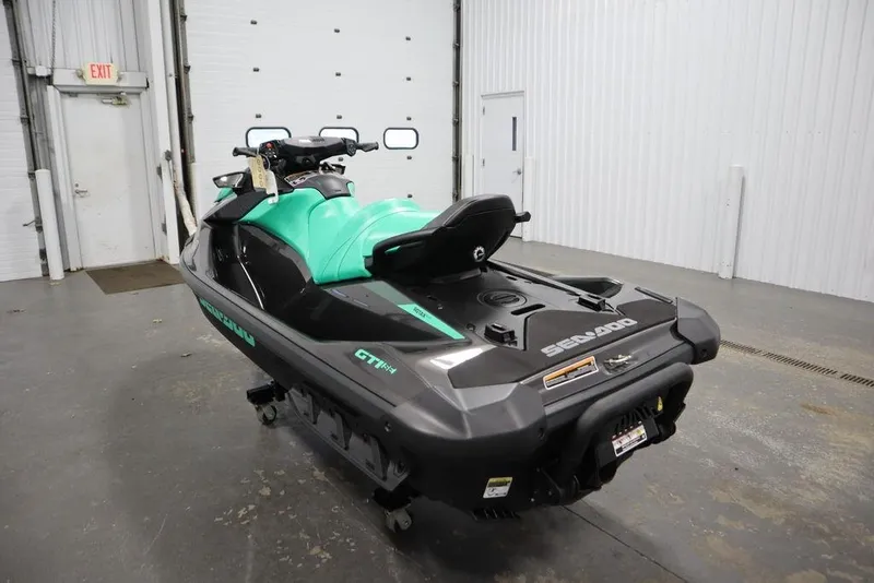 Slide: The Image of 2026 Sea-Doo GTI SE 170 jet ski in a garage setting. - 3