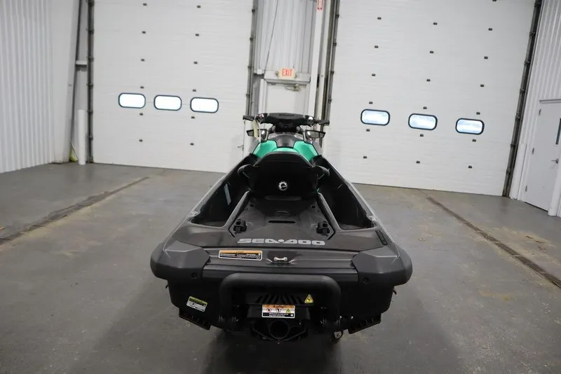 Slide: The Image of 2026 Sea-Doo GTI SE 170 jet ski in a garage, rear view. - 4