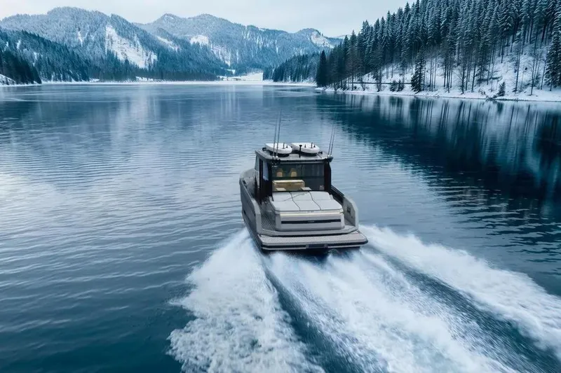 Slide: The Image of De Antonio Yachts D36 CABIN 2026 on a snowy lake. - 5