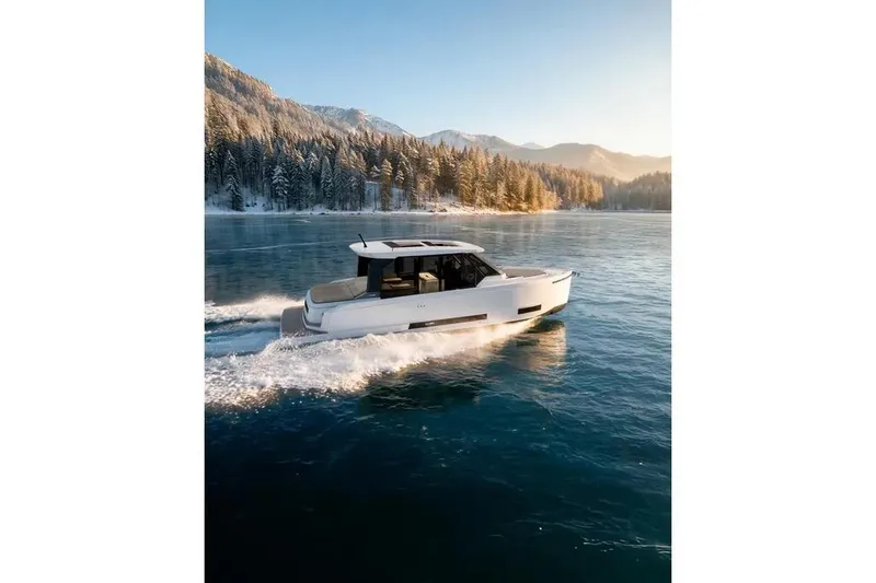 Slide: The Image of De Antonio Yachts D36 CABIN 2026 on a serene lake. - 3