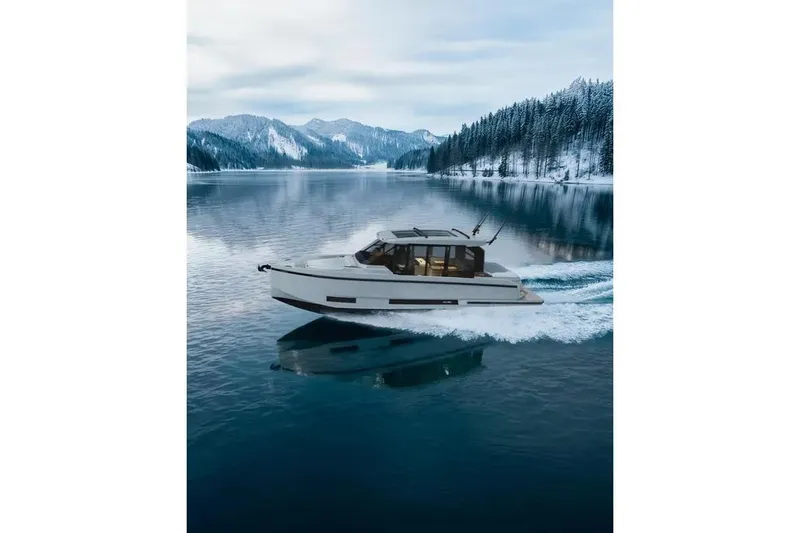 Slide: The Image of De Antonio Yachts D36 CABIN 2026 on a serene lake. - 6