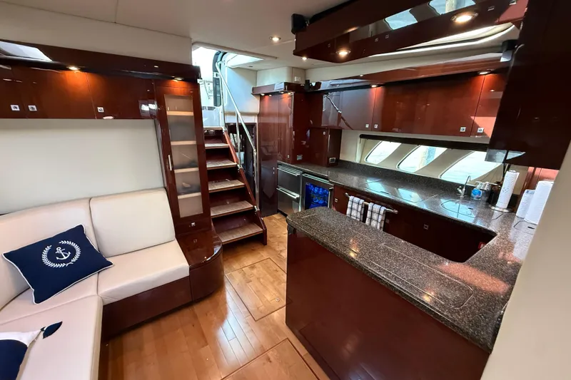 Slide: The Image of Luxurious interior of 2008 Sea Ray 550 Sundancer yacht with modern kitchen and seating area. - 10