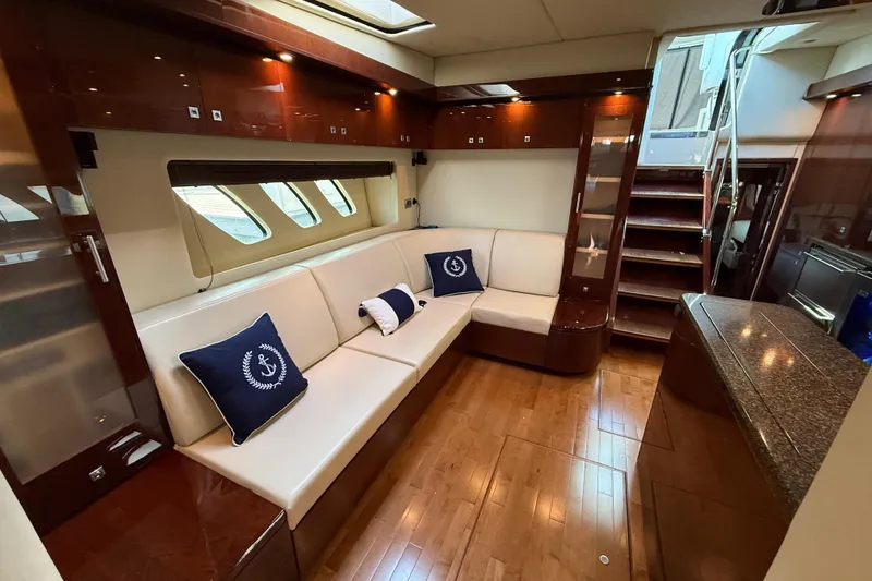 Slide: The Image of Luxurious interior of 2008 Sea Ray 550 Sundancer yacht with elegant seating and wooden finishes. - 12