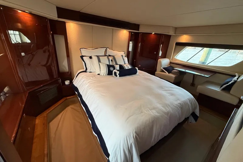 Slide: The Image of Luxurious bedroom interior of 2008 Sea Ray 550 Sundancer yacht with elegant furnishings. - 15